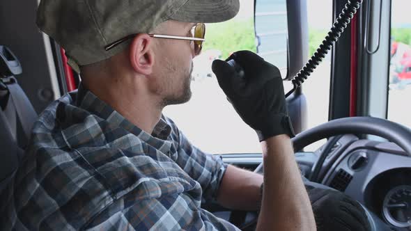 Semi Truck Driver Talking on CB Radio