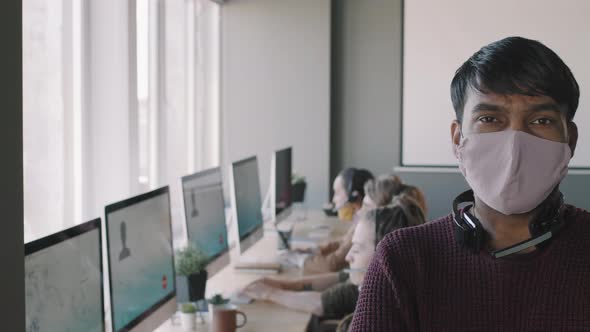 Portrait of Call Center Operator in Face Mask