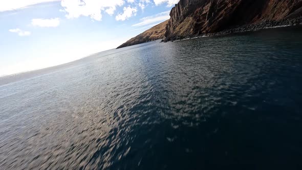 FPV Racing Drone Mountain Surfing and Cliff Diving Along the Rocks