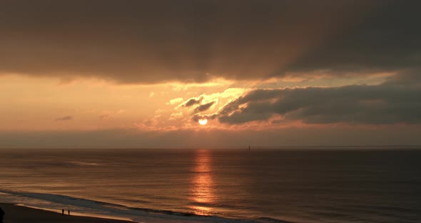 Beautiful sunset on the coastline of Sylt with the sun reflected in the sea