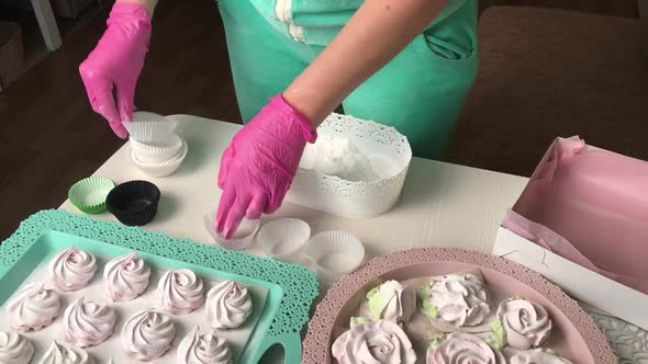 A Woman Prepares Marshmallows For Packaging.