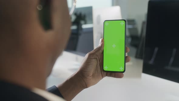 Close Up of Man Using Smartphone with Chroma Key Green Screen Without Touching Screen Online