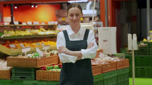 Store Manager Shows Groceries Department Smiling Closeup
