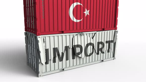 Container with IMPORT Text Being Crashed with Container with Flag of Turkey alt