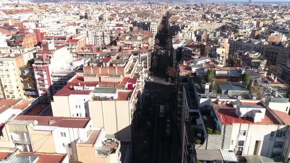 Flying Over Streets and Buildings of Barcelona in Spain