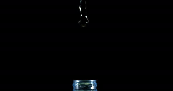 Water Exploding and Splashing on Bottle against Black Background, Slow motion 4K