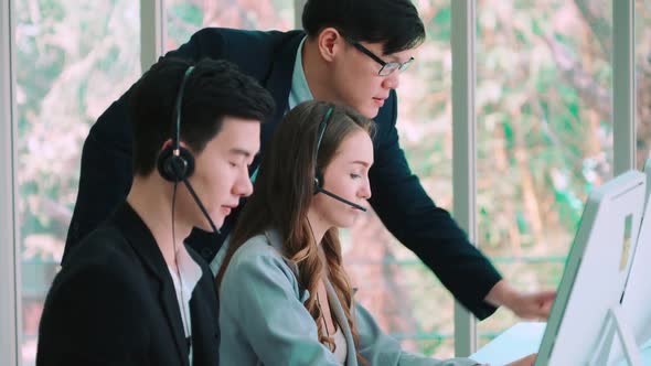 Business People Wearing Headset Working in Office