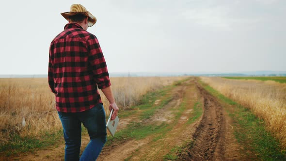 Smart Agriculture Technology Farmer Holding Tablet with Smart Technology