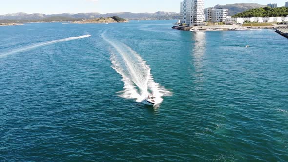 Fast boat driving by the city of Stavanger in the summer of Norway 2018