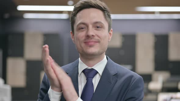 Portrait Shot of Happy Businessman Clapping Applauding