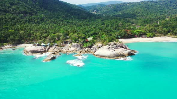 Unspoiled tropical coast with the turquoise seawater, rocks, and jungle. Thailand