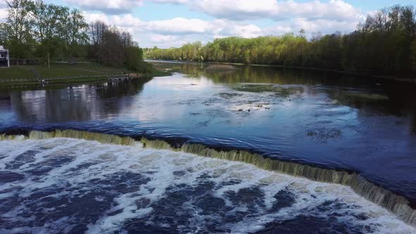 Flying Fish at Ventas Rumba The Widest Waterfall in Europe in Latvia Kuldiga, Aerial Dron Shot