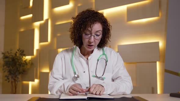 Woman Practitioner Consulting Patient Remotely