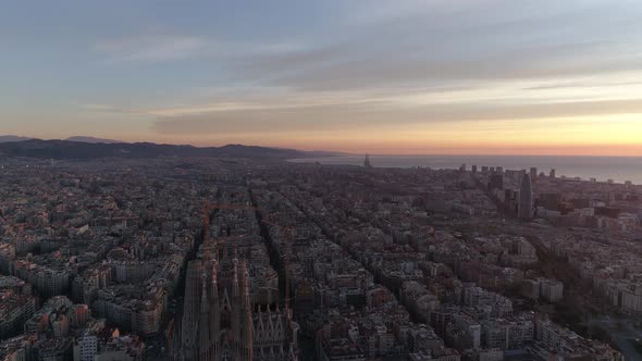 Aerial top view of Barcelona Eixample district street and block buildings, urban area, Spain Sunrise