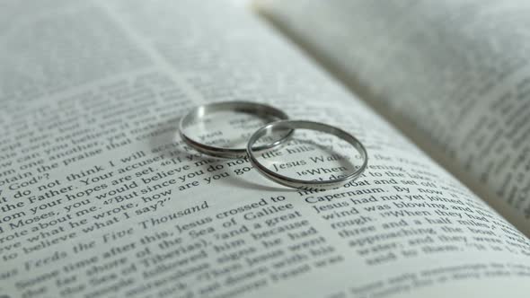 Wedding Rings On Bible alt