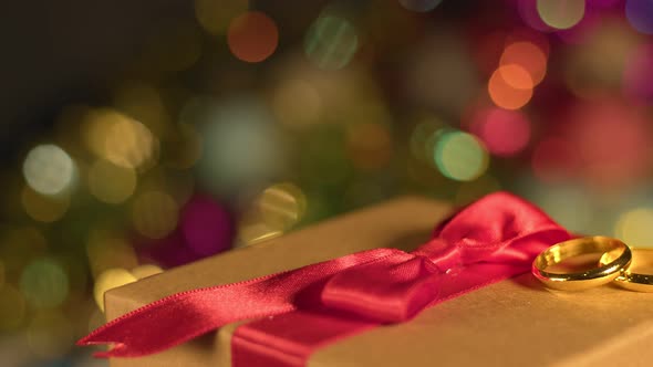 Valentines Day Wedding Ring On Giftbox And Colorful Bokeh 1