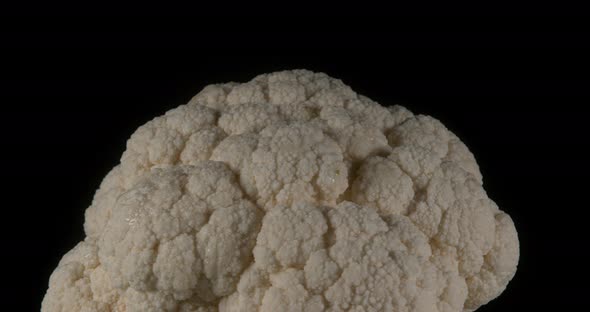 Cauliflower, brassica oleracea, Vegetable Turning against Black Background, Slow Motion 4K