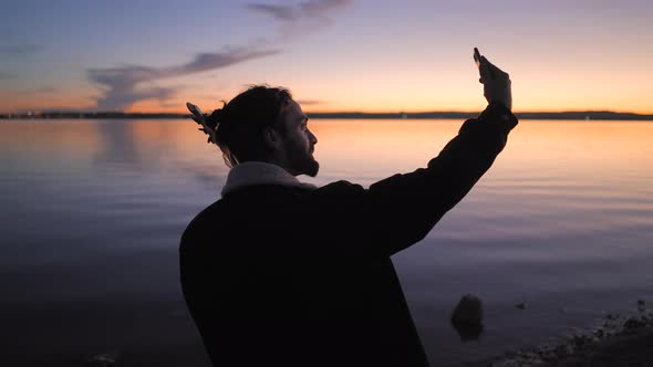 Spanish Bearded Guitarist Take a Selfie Picture with His Guitar at Sunset By Torrevieja Pink Lake in