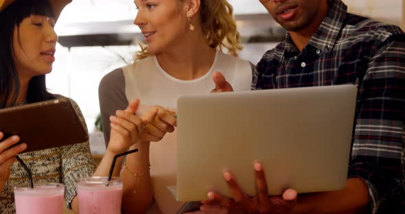 Executives discussing over laptop 4k