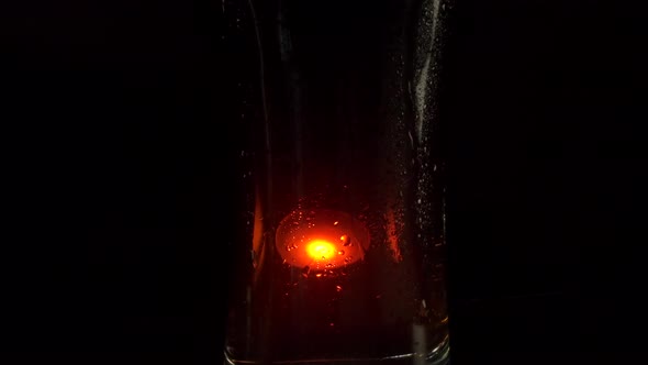 Specks of Light on Cola Glass