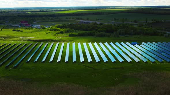 Drone View Solar Panels Park in Green Field