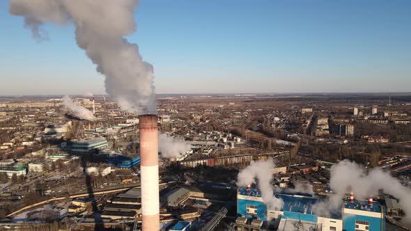 Industrial factory emissions of carbon gases with smoke in atmosphere