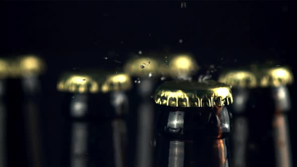 Super Slow Motion on the Lid of the Beer Bottle Drops Water