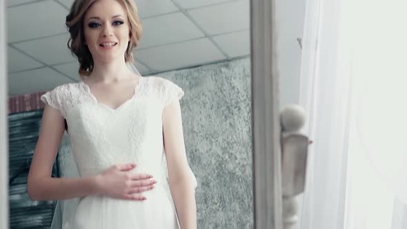 Bride Standing in Front of the Mirror