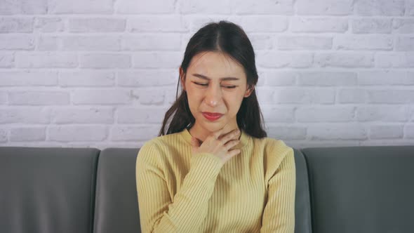 Woman Suffering From Sore Throat