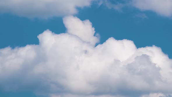 Time Lapse Footage of Fast Moving White Puffy Cumulus Clouds on Blue Clear Sky