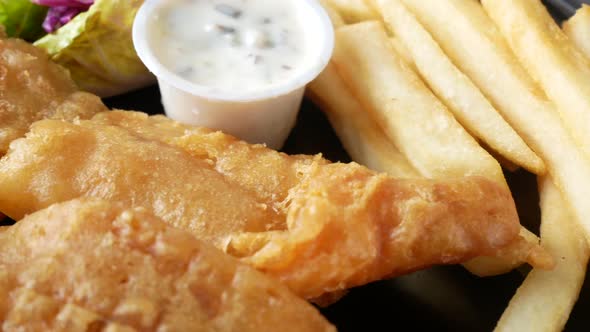 Fish Fillet Lemon  Chips and Potato Mash on Table