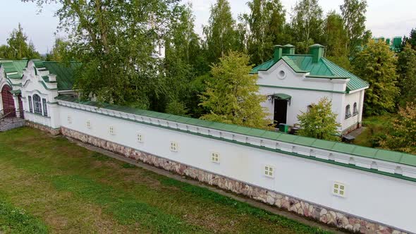 The Drone Smoothly Gains Height Above the Monastery