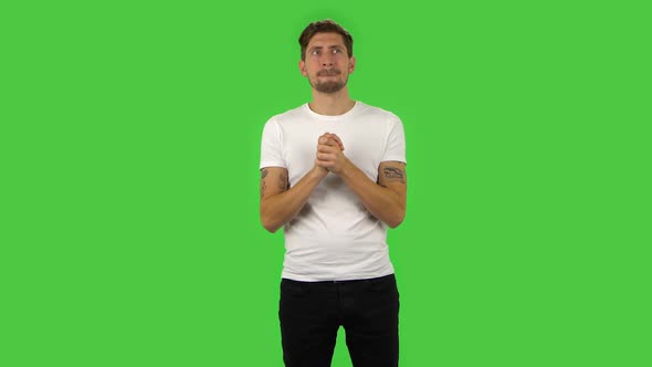 Confident Guy Is Waiting in Anticipation with Pleasure. Green Screen