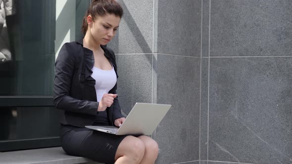 Pensive Working Business Woman Sitting Outside Office