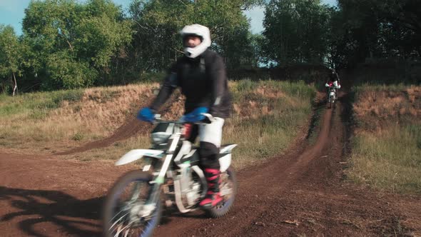 Men in Gear Riding Motorcycles Off-Road