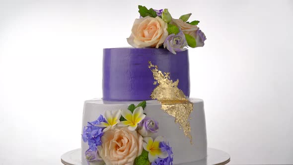 Delightful Festive Cream Bunk Cake with Purple Roses