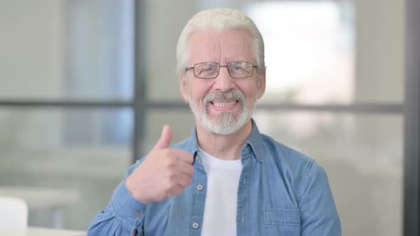 Portrait of Senior Old Man Showing Thumbs Up Sign