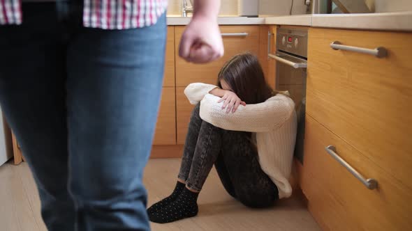 Teenage Girl Crying on Kitchen Floor After Being Beat By Angry Father