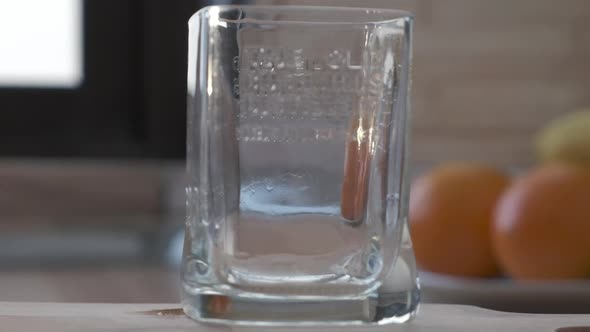 Orange Juice Pouring Into A Glass - zoom in, slow motion