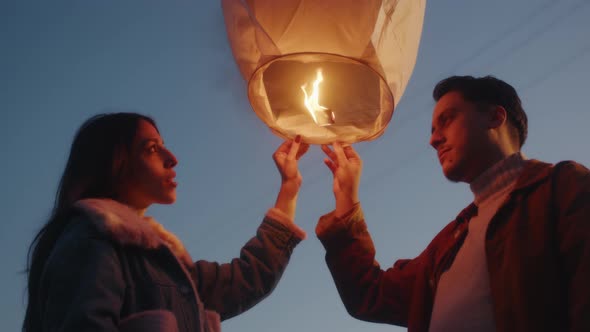 Couple Holding a Chinese Lantern