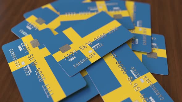 Pile of Credit Cards with Flag of Sweden alt