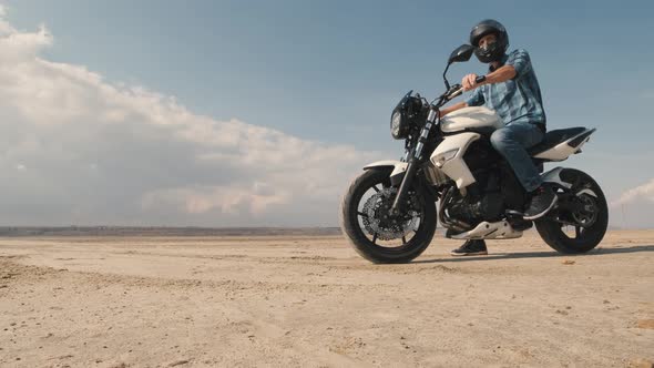 Man Biker Doing Tire Burnout in the Desert Slow Motion