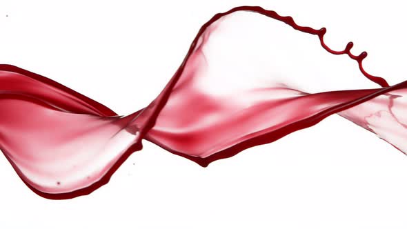 Super Slow Motion Shot of Red Wine Spiral Splash Isolated on White Background at 1000 Fps.