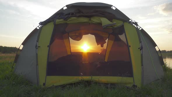 Setting Sun Shines Through the Camping Tent