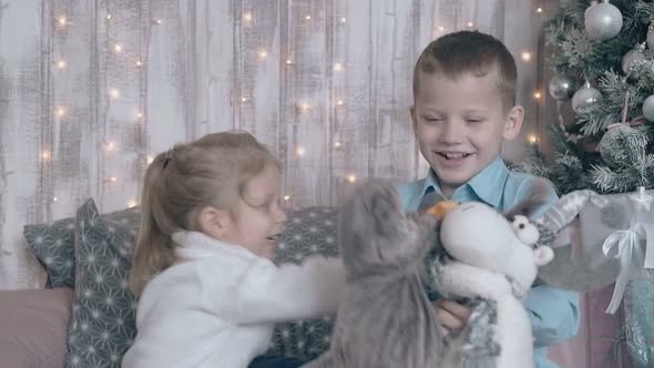 Fair Haired Brother and Sister Play Stuffed Animal Toys