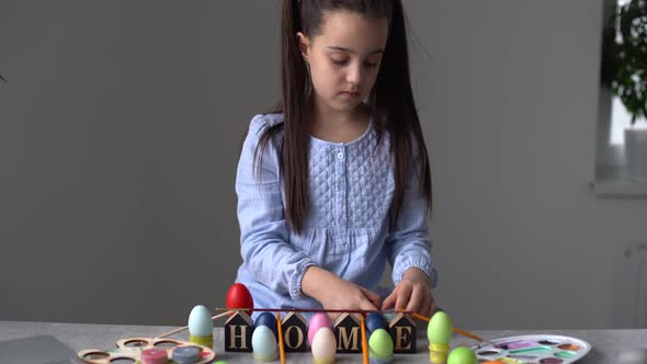 A Girl Showing Her Painted Easter Egg