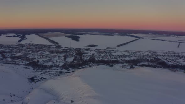 View of the Russian Village After Snowfall at Dawn in Winter