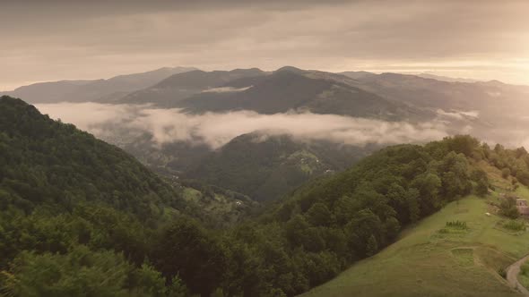 Sunrise Over Fog Mountain Ridges Aerial