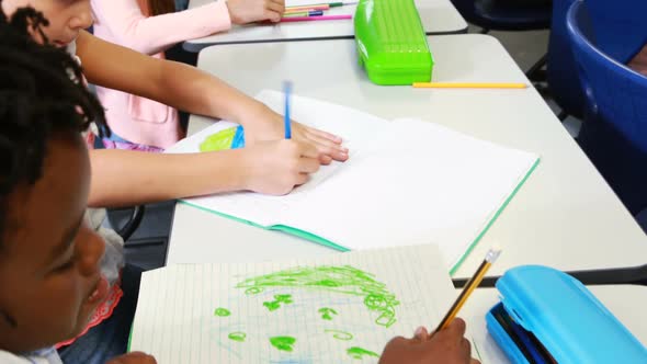 Kids drawing in classroom