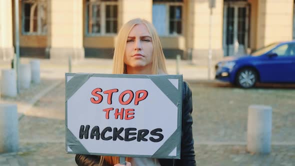 Concerned Woman with Protest Banner Calling to Stop Hackers